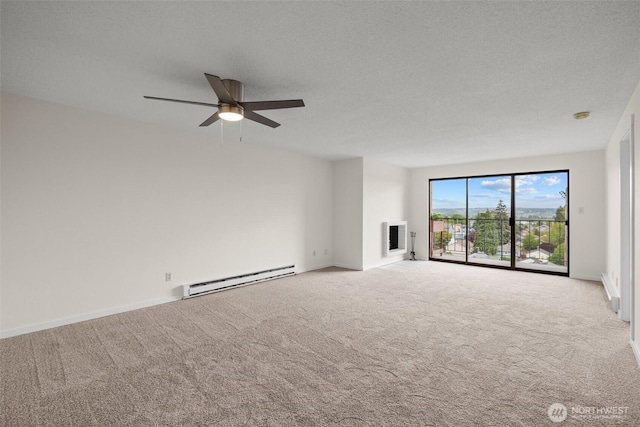 3425 Colby Ave Unit 502, Everett, WA 98201 - carpeted spare room featuring a baseboard radiator, a ceiling fan, and baseboards