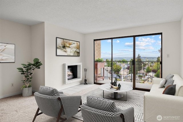 3425 Colby Ave Unit 502, Everett, WA 98201 - living room with a fireplace, carpet flooring, a textured ceiling, and baseboards