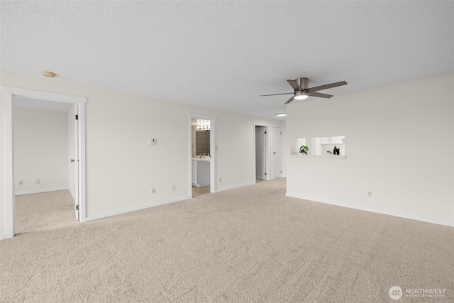 3425 Colby Ave Unit 502, Everett, WA 98201 - spare room with a ceiling fan, carpet floors, baseboards, a textured ceiling, and a smoke detector