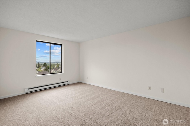 3425 Colby Ave Unit 502, Everett, WA 98201 - carpeted empty room with a baseboard heating unit and baseboards