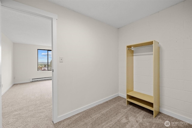 3425 Colby Ave Unit 502, Everett, WA 98201 - unfurnished bedroom with carpet, a baseboard radiator, and baseboards