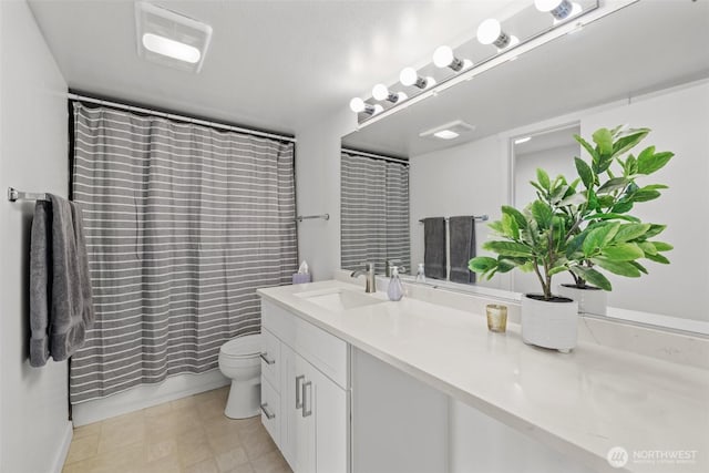 3425 Colby Ave Unit 502, Everett, WA 98201 - bathroom featuring vanity, toilet, and curtained shower