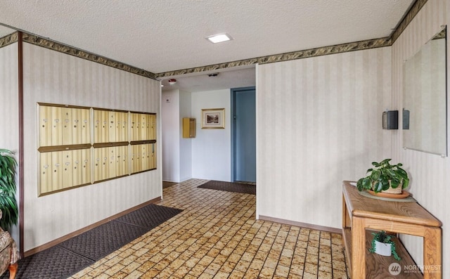3425 Colby Ave Unit 502, Everett, WA 98201 - corridor with baseboards, a textured ceiling, brick patterned flooring, and wallpapered walls