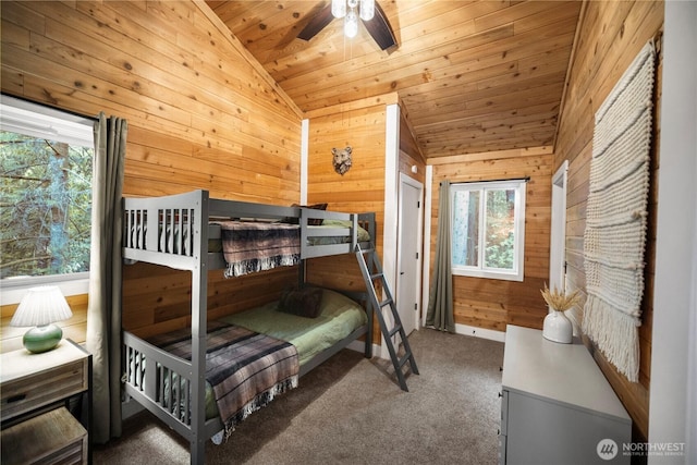 bedroom featuring wood walls, lofted ceiling, carpet, and wood ceiling