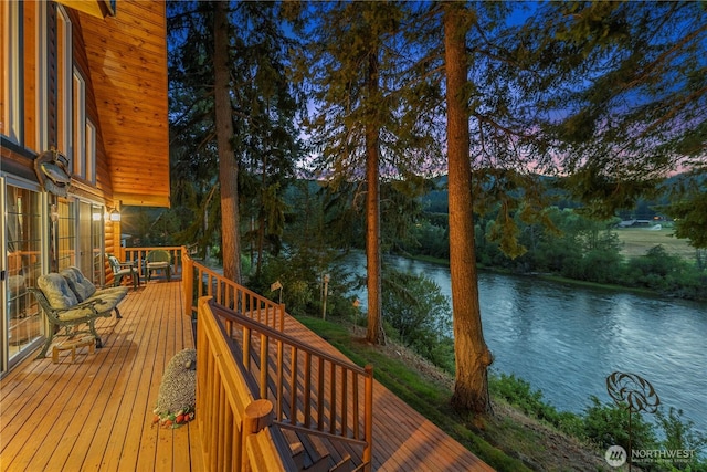 wooden terrace with a water view