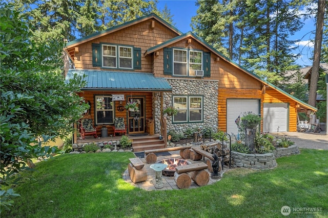 view of front of home featuring an attached garage, driveway, stone siding, and a front lawn