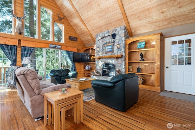 living room featuring wood ceiling, high vaulted ceiling, hardwood / wood-style flooring, beamed ceiling, and a stone fireplace