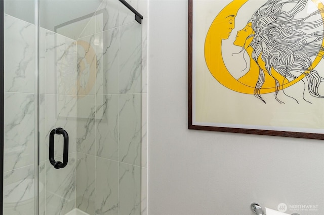 full bathroom with a marble finish shower