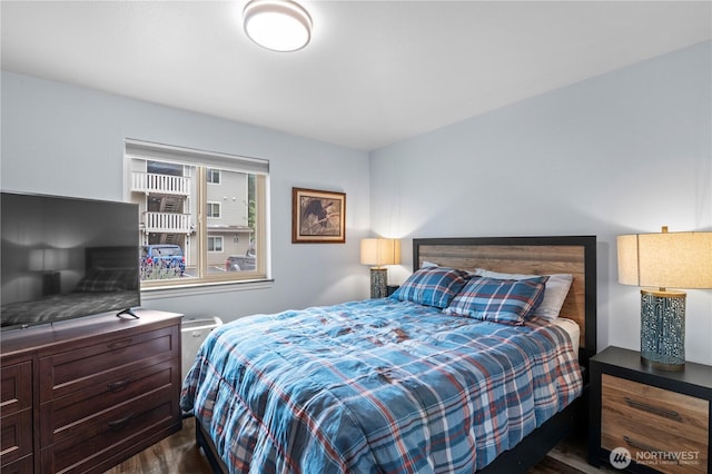 bedroom featuring dark wood-type flooring