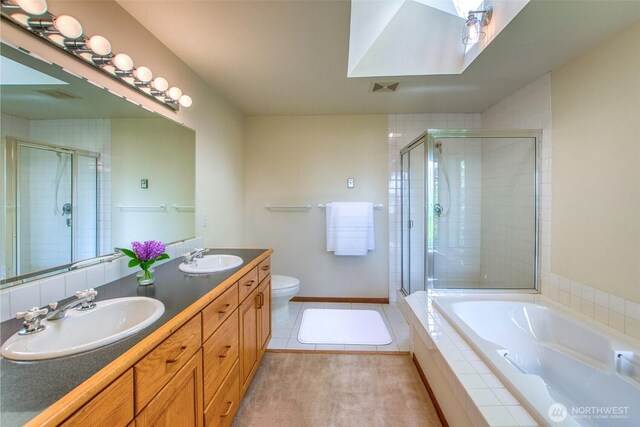 55 Langell Ln, Orcas Island, WA 98245 - full bath featuring a stall shower, double vanity, a garden tub, and toilet