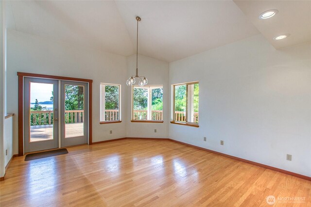55 Langell Ln, Orcas Island, WA 98245 - spare room featuring healthy amount of natural light, baseboards, light wood finished floors, high vaulted ceiling, and recessed lighting