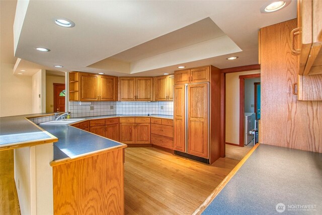 55 Langell Ln, Orcas Island, WA 98245 - kitchen with a sink, recessed lighting, light wood-type flooring, backsplash, and brown cabinetry