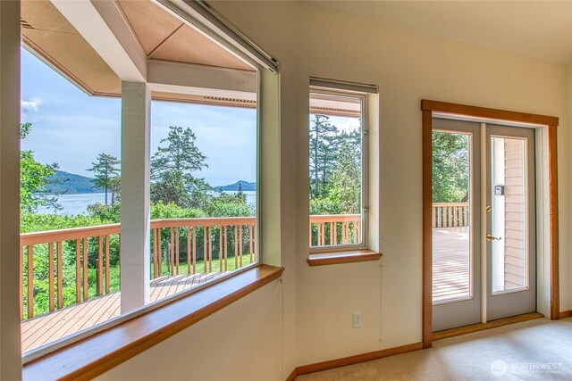 55 Langell Ln, Orcas Island, WA 98245 - doorway to outside with baseboards and carpet floors