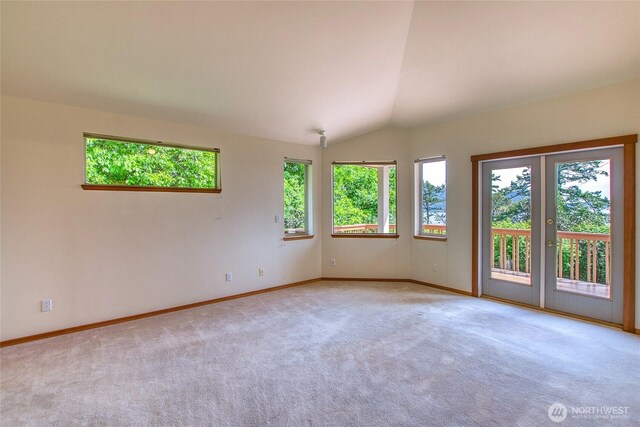55 Langell Ln, Orcas Island, WA 98245 - carpeted spare room with baseboards, vaulted ceiling, and french doors