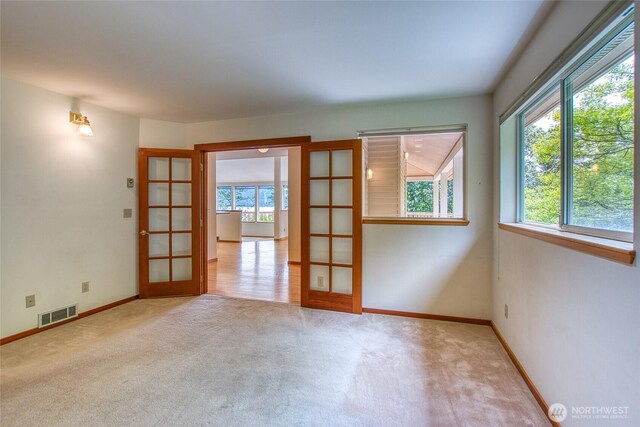 55 Langell Ln, Orcas Island, WA 98245 - empty room with french doors, carpet floors, and baseboards