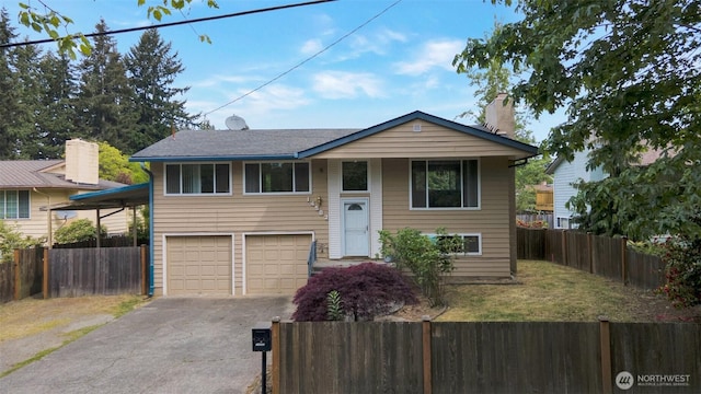 14502 Main St, Bellevue, WA 98007 - raised ranch featuring driveway, an attached garage, and a chimney