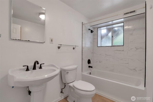 14502 Main St, Bellevue, WA 98007 - bathroom featuring toilet, shower / bath combination, and baseboards