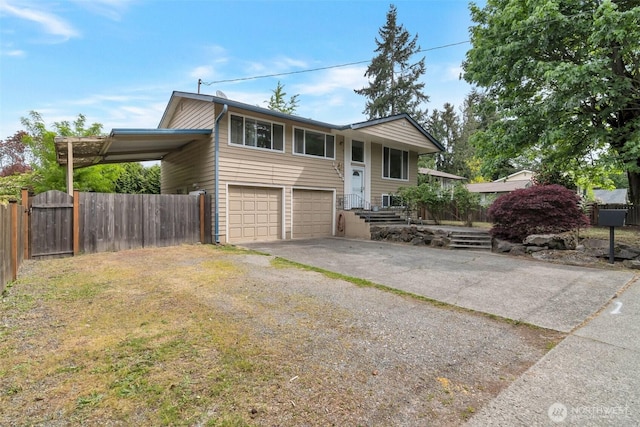14502 Main St, Bellevue, WA 98007 - bi-level home with driveway, an attached garage, and fence