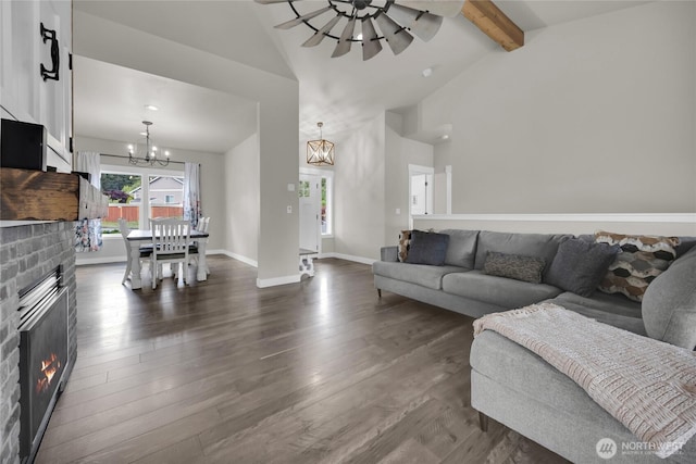 13800 27th Dr NW, Tulalip, WA 98271 - living area featuring a chandelier, dark wood finished floors, a brick fireplace, and baseboards