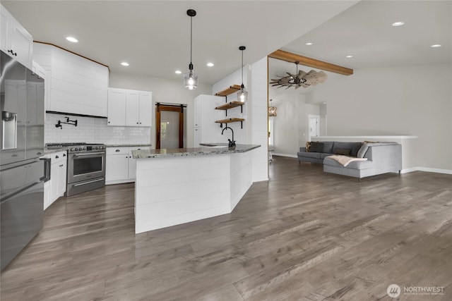 13800 27th Dr NW, Tulalip, WA 98271 - kitchen with appliances with stainless steel finishes, tasteful backsplash, a sink, stone counters, and white cabinetry
