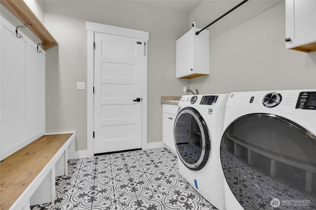 13800 27th Dr NW, Tulalip, WA 98271 - washroom featuring cabinet space, separate washer and dryer, and baseboards