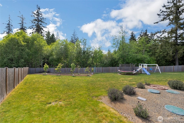 13800 27th Dr NW, Tulalip, WA 98271 - view of yard with a trampoline and a playground