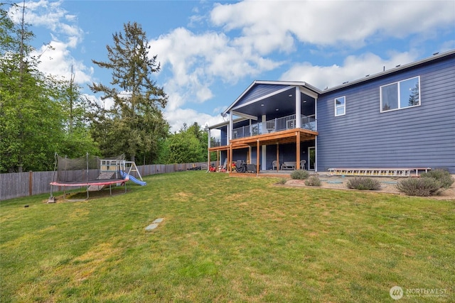 13800 27th Dr NW, Tulalip, WA 98271 - view of yard featuring a trampoline and a deck