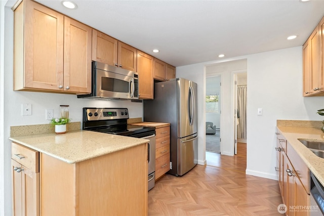15212 NE 8th St Unit F3, Bellevue, WA 98007 - kitchen featuring stainless steel appliances, recessed lighting, light stone countertops, baseboards, and a sink