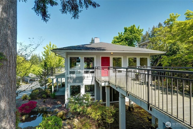 15212 NE 8th St Unit F3, Bellevue, WA 98007 - view of front of property with a chimney, stairs, and roof with shingles