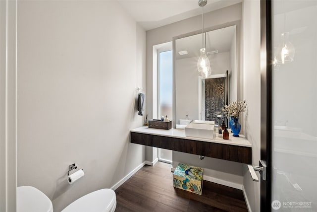 20006 149th St E, Bonney Lake, WA 98391 - bathroom with toilet, baseboards, wood finished floors, and vanity