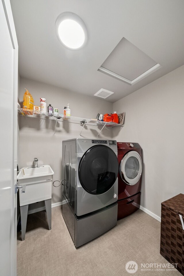 20006 149th St E, Bonney Lake, WA 98391 - washroom featuring separate washer and dryer, light colored carpet, and baseboards