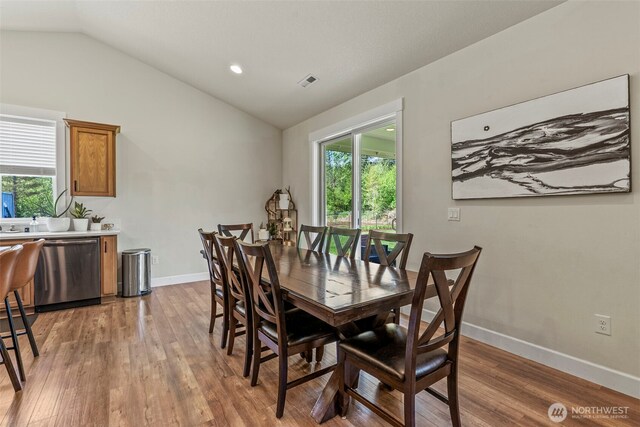 266 Fir Rd, Ariel, WA 98603 - dining area featuring vaulted ceiling, healthy amount of natural light, wood finished floors, baseboards, and recessed lighting