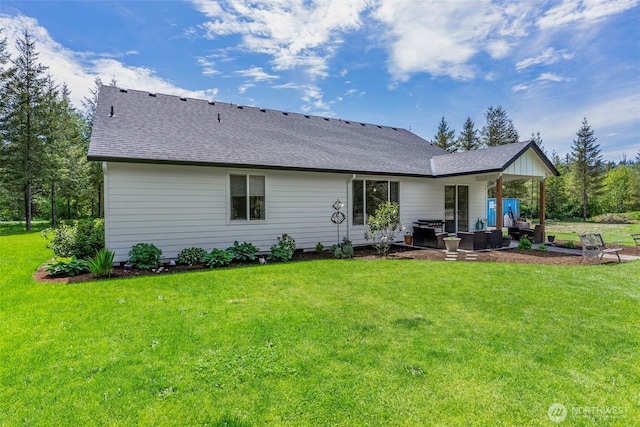 266 Fir Rd, Ariel, WA 98603 - rear view of property with a yard, a shingled roof, and a patio area