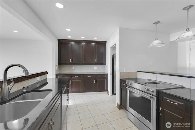 16015 Inglewood Rd NE, Kenmore, WA 98028 - kitchen featuring appliances with stainless steel finishes, a sink, decorative backsplash, light tile patterned flooring, and recessed lighting