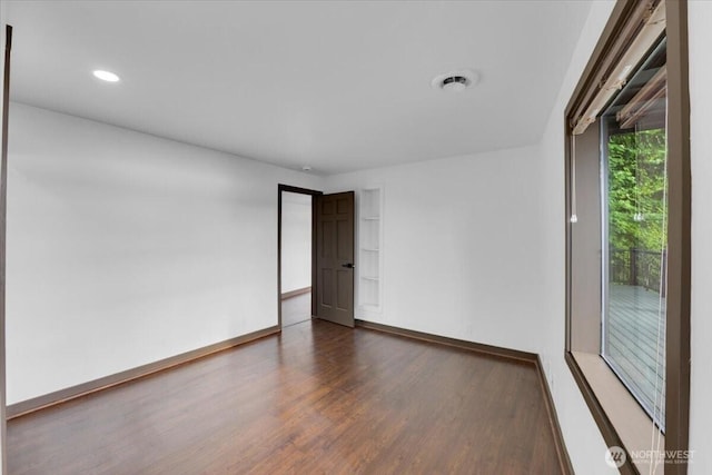 16015 Inglewood Rd NE, Kenmore, WA 98028 - empty room with wood finished floors, baseboards, and recessed lighting