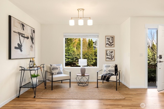 17427 92nd Ave NE, Bothell, WA 98011 - living area featuring wood finished floors, plenty of natural light, and baseboards