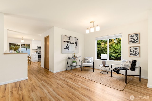 17427 92nd Ave NE, Bothell, WA 98011 - living area featuring light wood-style floors, healthy amount of natural light, and baseboards