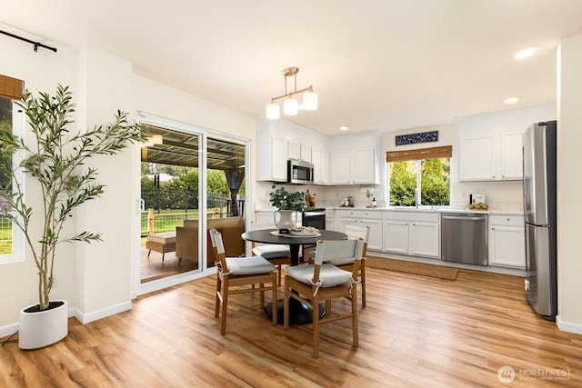 17427 92nd Ave NE, Bothell, WA 98011 - dining space with light wood-style floors, baseboards, and recessed lighting