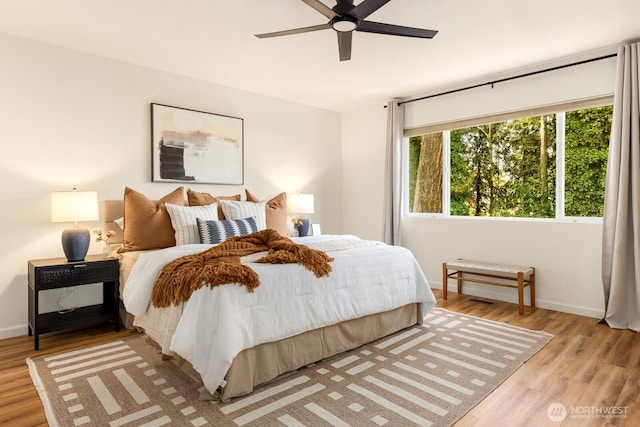 17427 92nd Ave NE, Bothell, WA 98011 - bedroom with light wood-style floors, baseboards, and ceiling fan