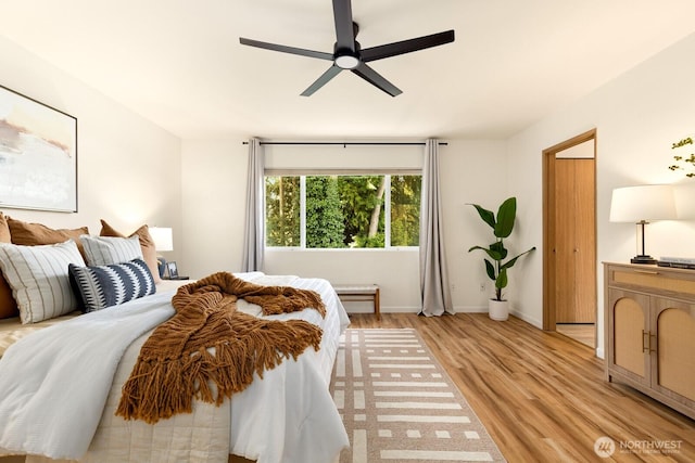 17427 92nd Ave NE, Bothell, WA 98011 - bedroom with light wood finished floors, ceiling fan, and baseboards