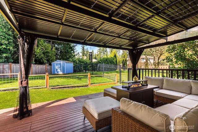 17427 92nd Ave NE, Bothell, WA 98011 - wooden deck featuring an outdoor living space with a fire pit, a storage shed, and an outbuilding