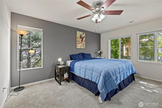 23782 SE Summerhill Ln Unit 5-4, Issaquah, WA 98029 - bedroom with carpet flooring, multiple windows, baseboards, and a ceiling fan
