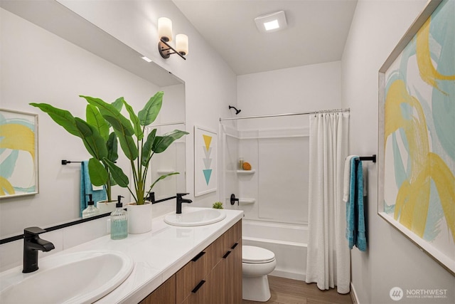 27335SITE401 NE Walden Way, Duvall, WA 98019 - full bath featuring toilet, double vanity, shower / bathtub combination with curtain, and wood finished floors