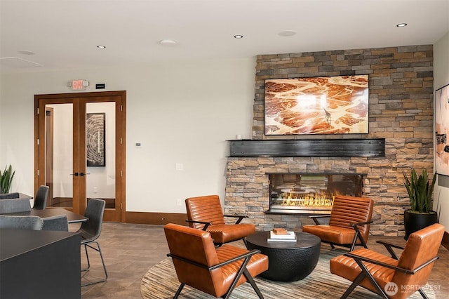 27335SITE401 NE Walden Way, Duvall, WA 98019 - living area with a fireplace, french doors, and recessed lighting