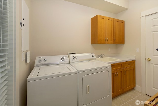 625 Argyle Ave Unit D, Friday Harbor, WA 98250 - laundry area featuring washer and clothes dryer, cabinet space, and light tile patterned floors