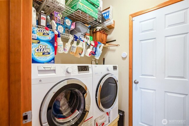 clothes washing area featuring washing machine and clothes dryer