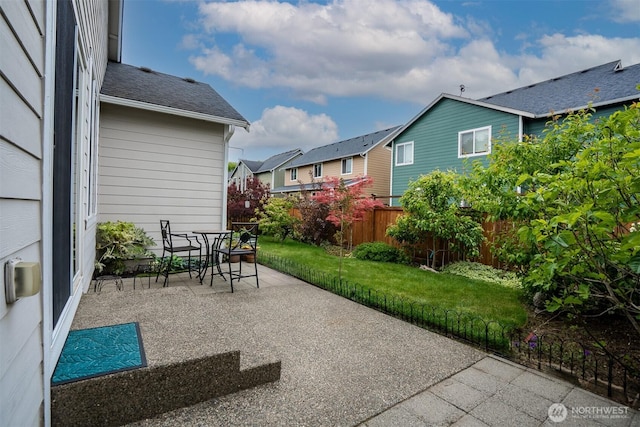 view of patio / terrace with a residential view and outdoor dining space