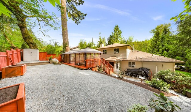 163 Polo Park Dr, Bellingham, WA 98229 - rear view of house with a gazebo, a fenced backyard, a patio area, and a deck