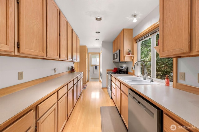 163 Polo Park Dr, Bellingham, WA 98229 - kitchen featuring appliances with stainless steel finishes, light countertops, light wood-style floors, light brown cabinets, and recessed lighting