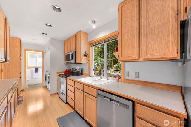 163 Polo Park Dr, Bellingham, WA 98229 - kitchen with stainless steel appliances, light countertops, light wood-style flooring, separate washer and dryer, and recessed lighting